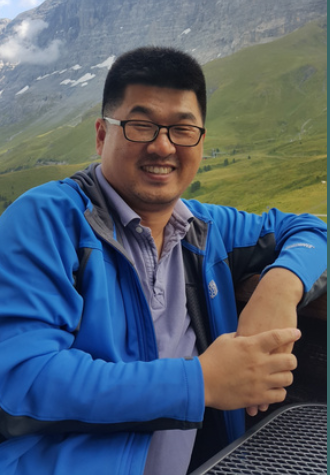 Image of man with a countryside background